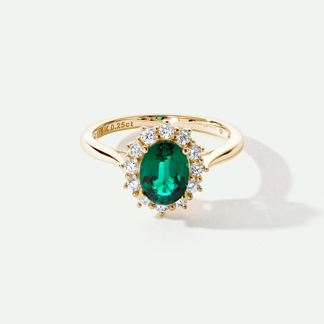 Oval Lab Created Emerald ring with a halo of lab grown diamonds