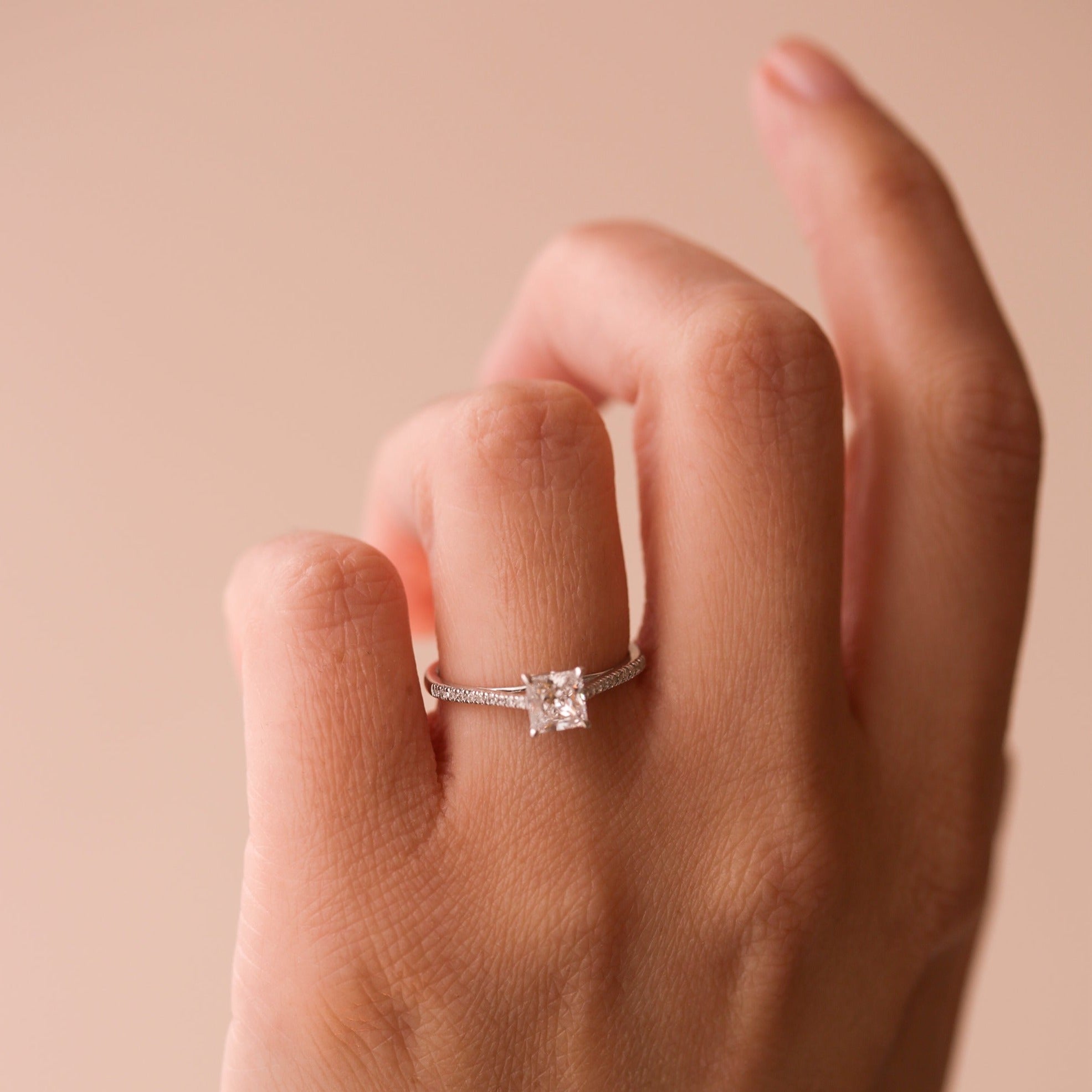 Platinum Engagement Ring with Princess Cut Sapphire and Trilliant Cut  Diamonds